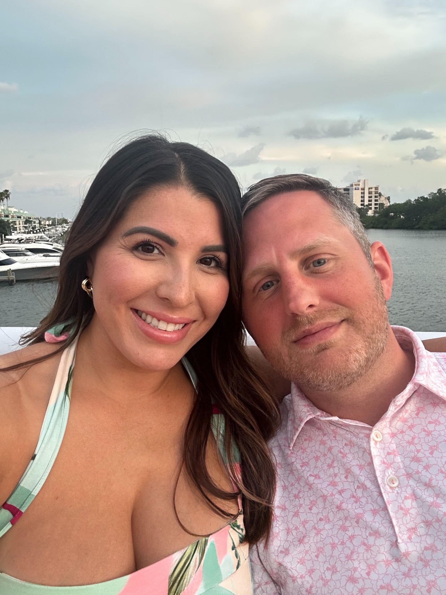 Matt and Ashley smiling together on the water in Tampa